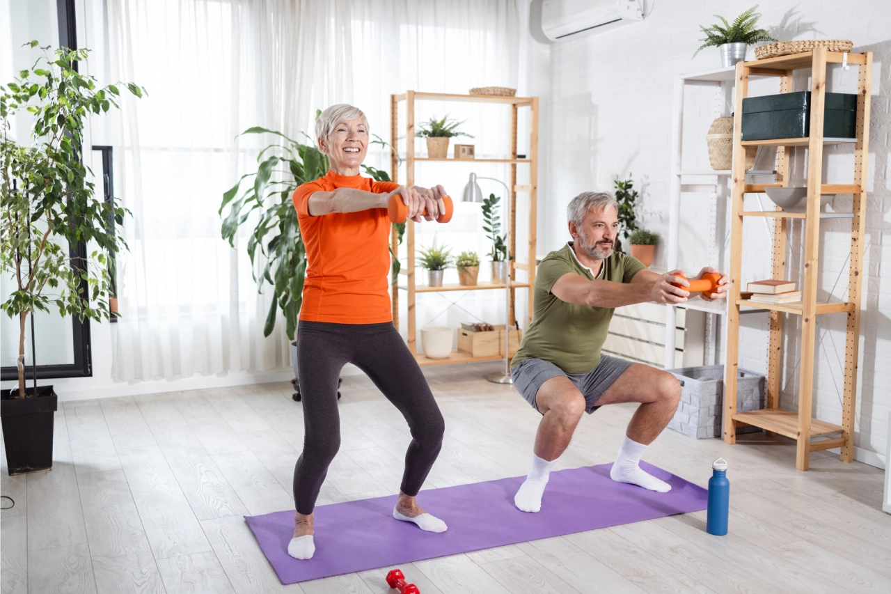 Seniors exercising with dumbbells on yoga mats.